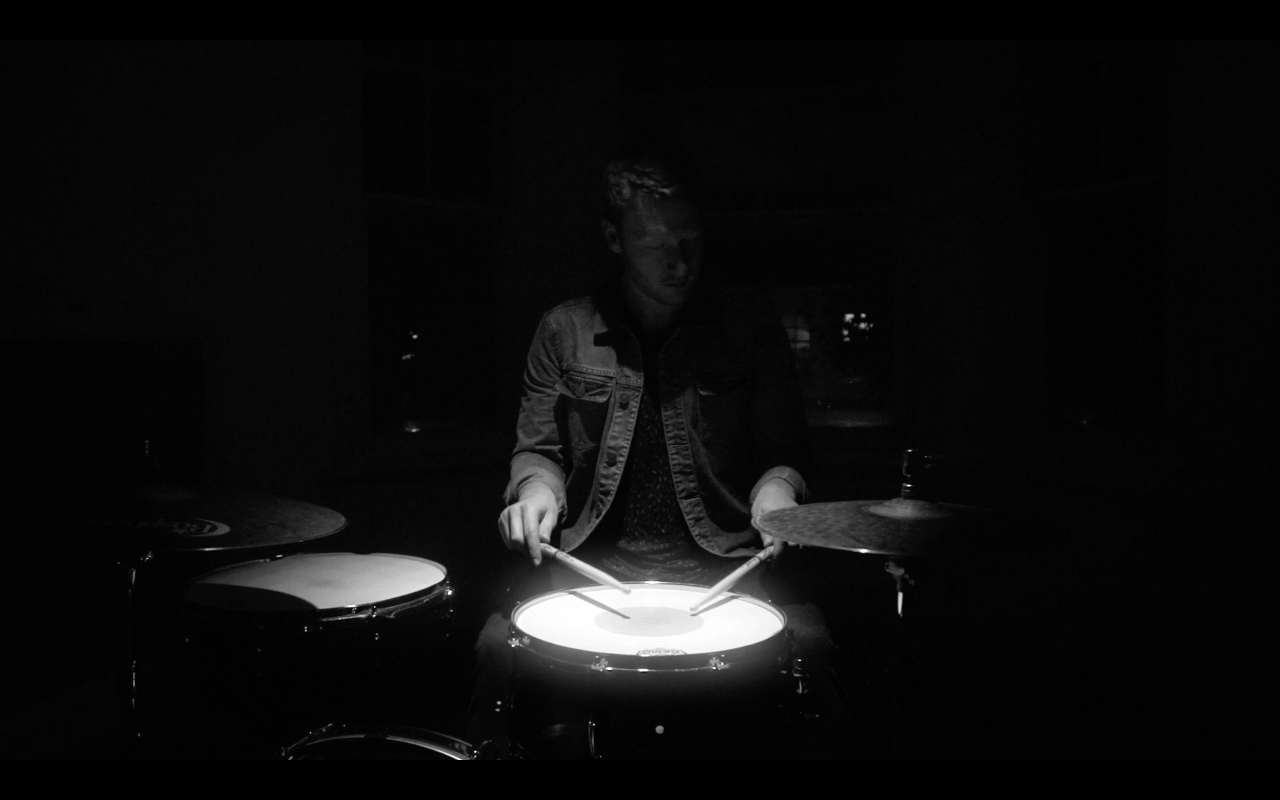 Alex Esp playing in The Yacht Club's Mouth of the Beast music video